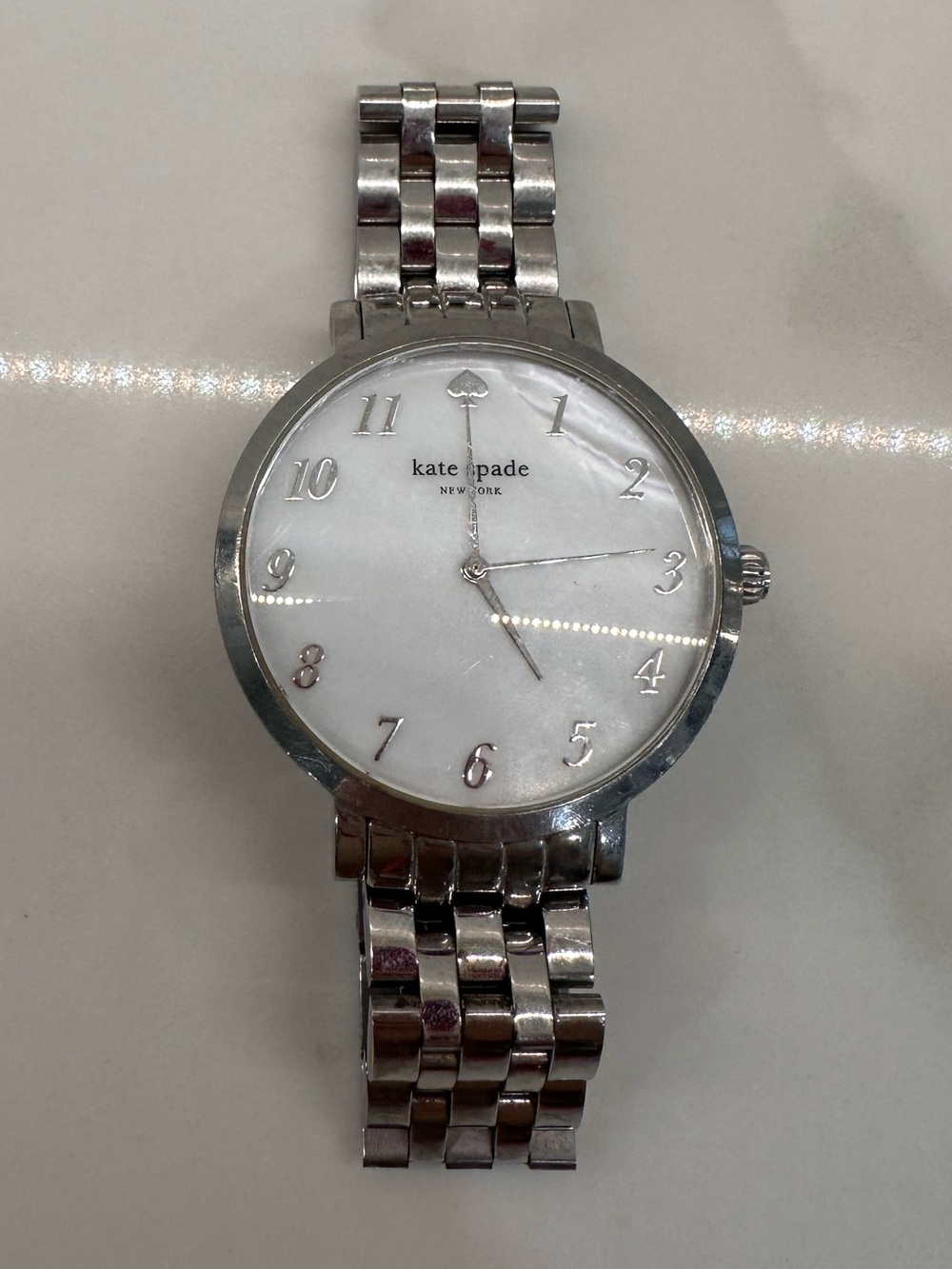 kate spade silver stainless steel watch with white dial NEEDS BATTERY